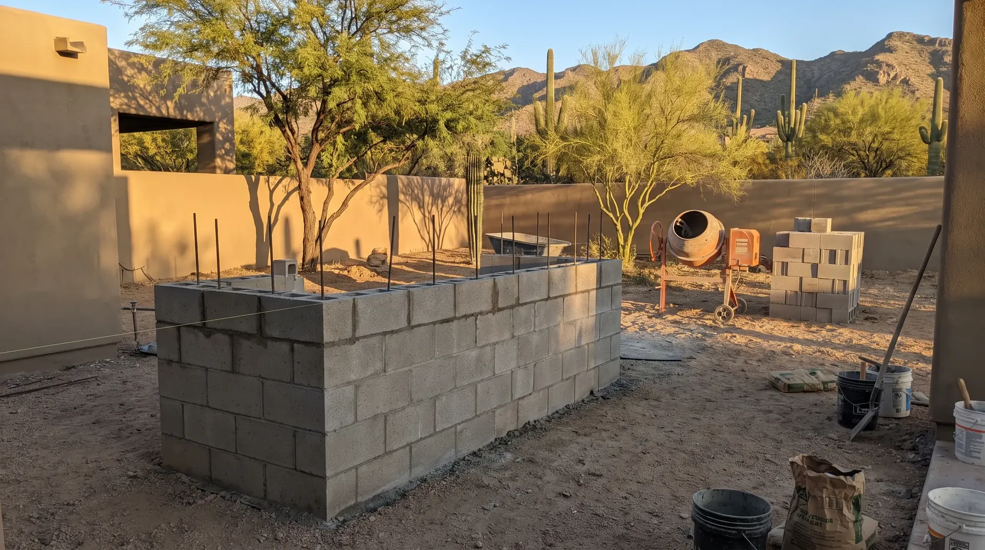 Block and rebar frame of an outdoor kitchen island under construction