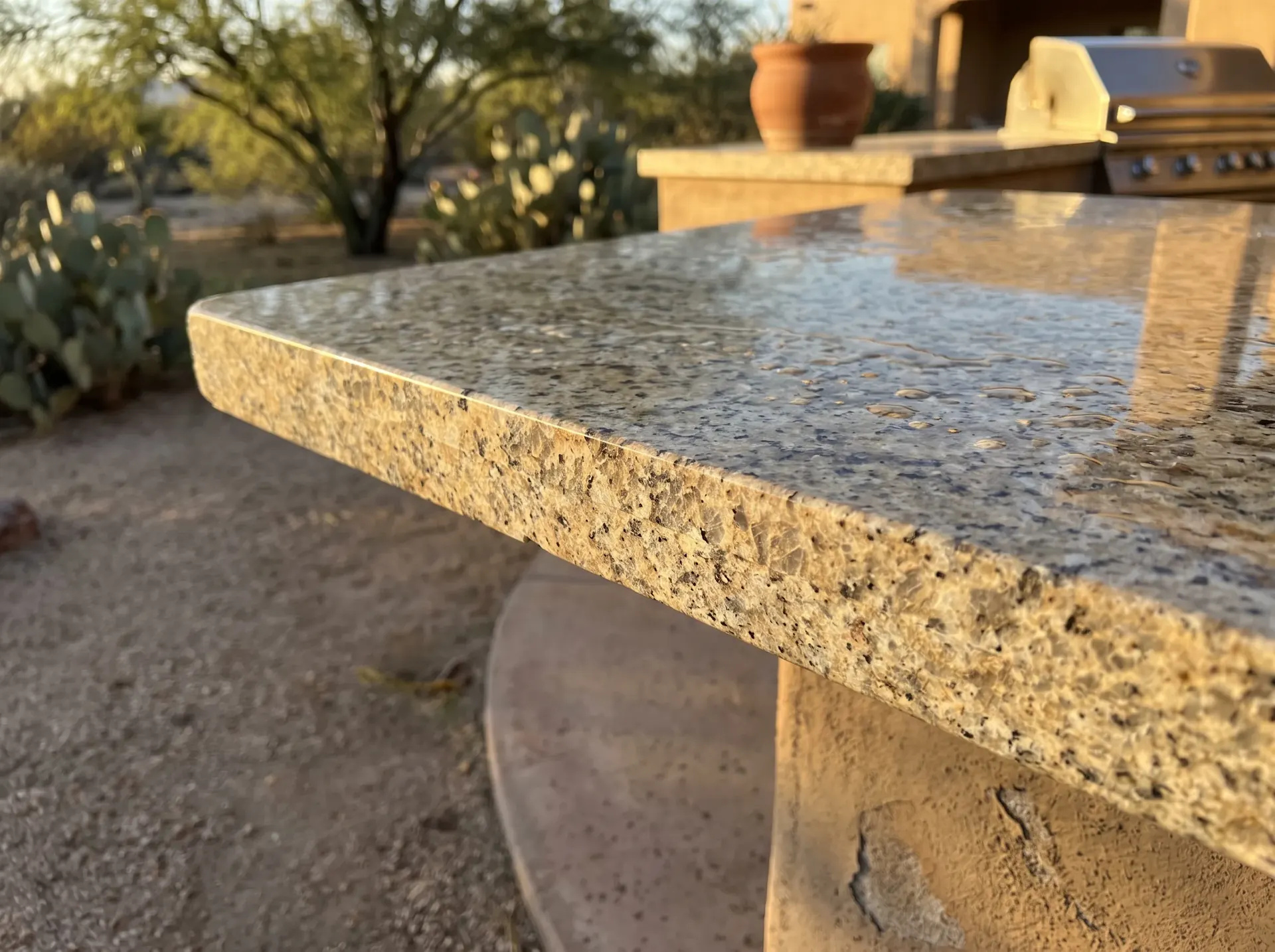 Close up of a polished granite outdoor kitchen countertop edge