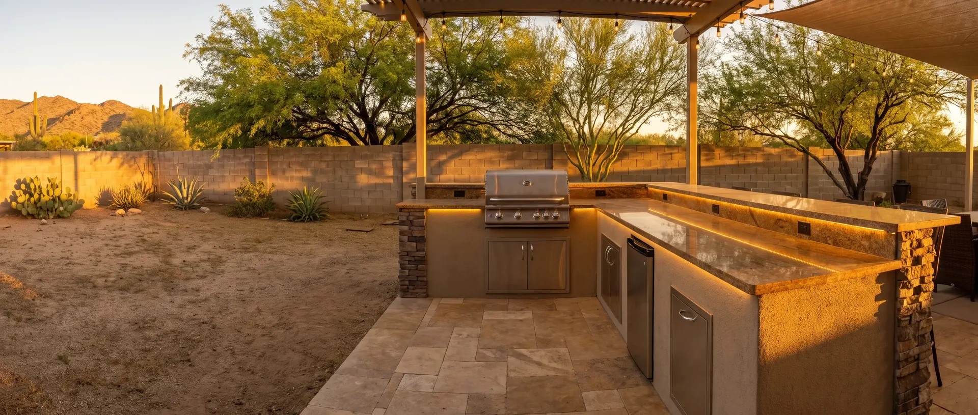Completed outdoor kitchen installation with a grill island and counter run in Tucson
