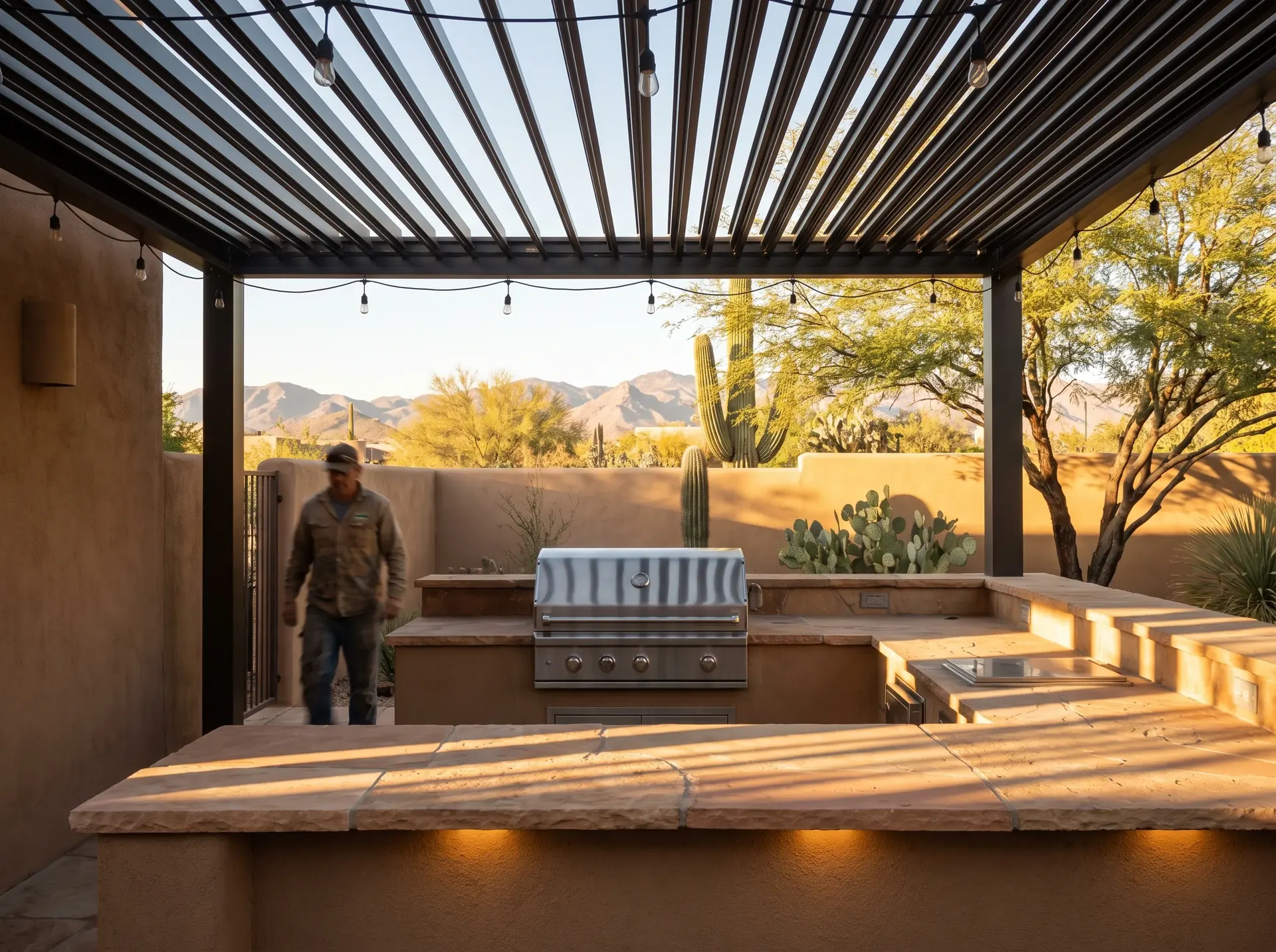 Louvered pergola over an outdoor kitchen cooking run in Tucson